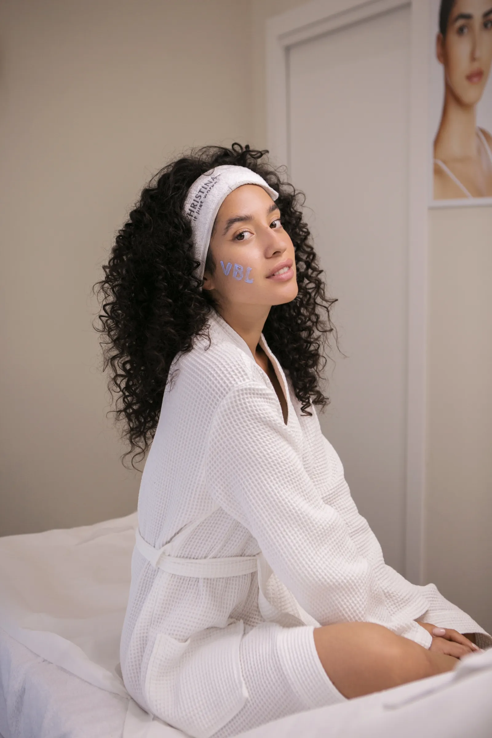 Client in a robe during a relaxing treatment at Velluto Beauty Lab